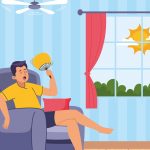 Man sitting in chair fanning himself during hot weather at home, showing heatwave, high temperature and discomfort indoors