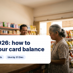 An aunty checking her MyKasih card balance at a grocery store terminal in the morning, iMoney SARA 2026 guide