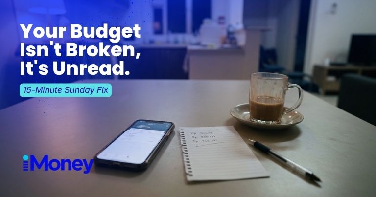 Table with handphone, paper note, pen and glass of teh tarik in the kitchen